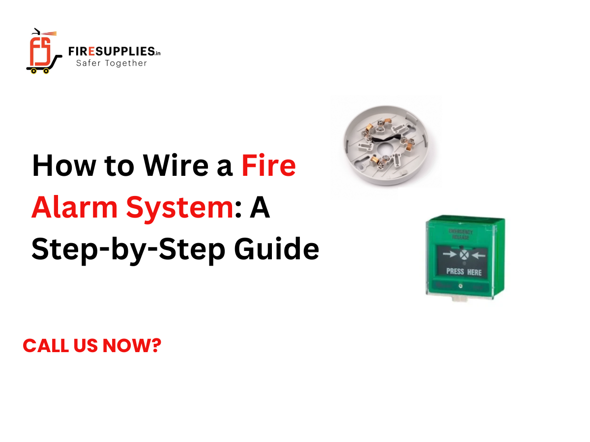 Technician wiring a fire alarm control panel with smoke detectors, manual call points, sounders, and fire alarm cables during a fire alarm system installation.